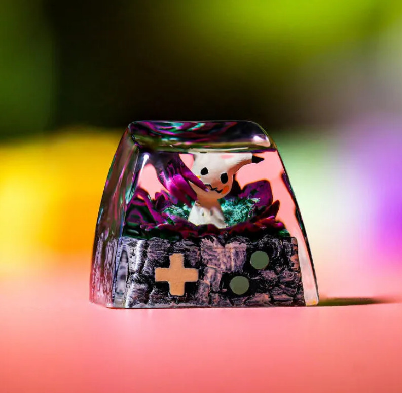 Mimikyu Pokemon Keycap 1 Mimikyu Pokemon Keycap showcases vibrant hues, highlighting its eerie charm